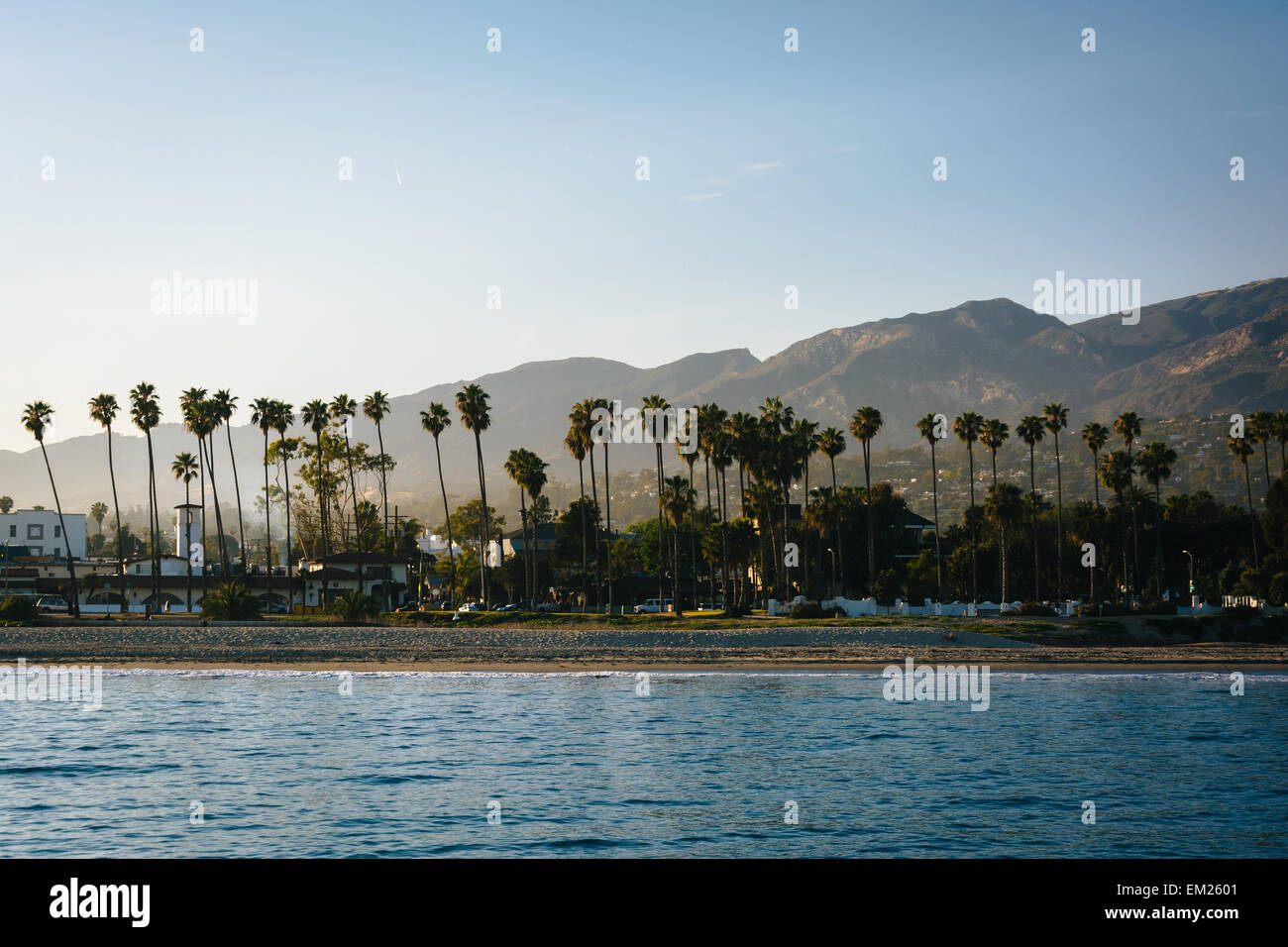 View of palm trees on the shore and mountains from Stearn's Wharf, in Santa Barbara, California. Stock Photo