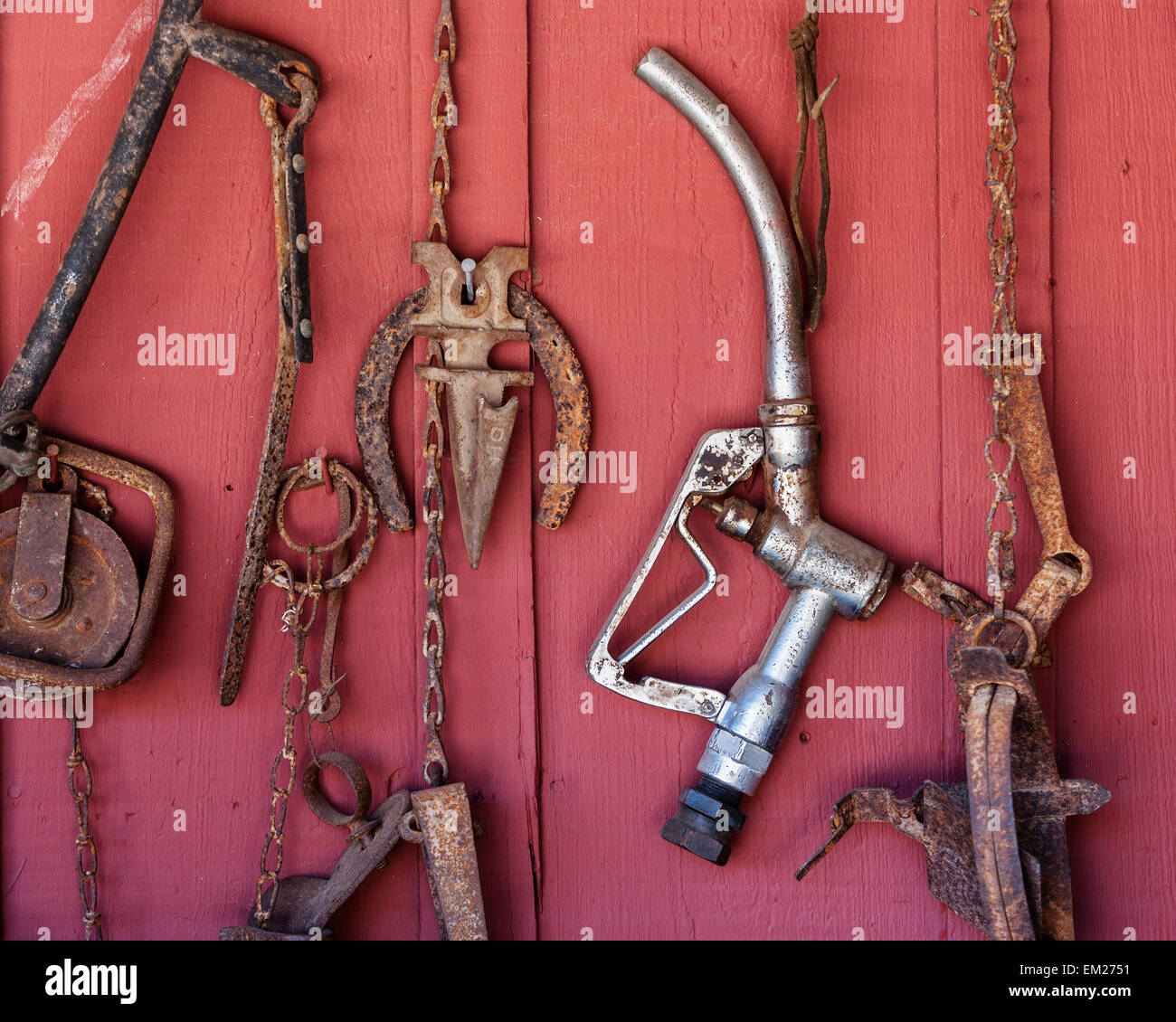 Farm tools and a gas pump handle Stock Photo Alamy