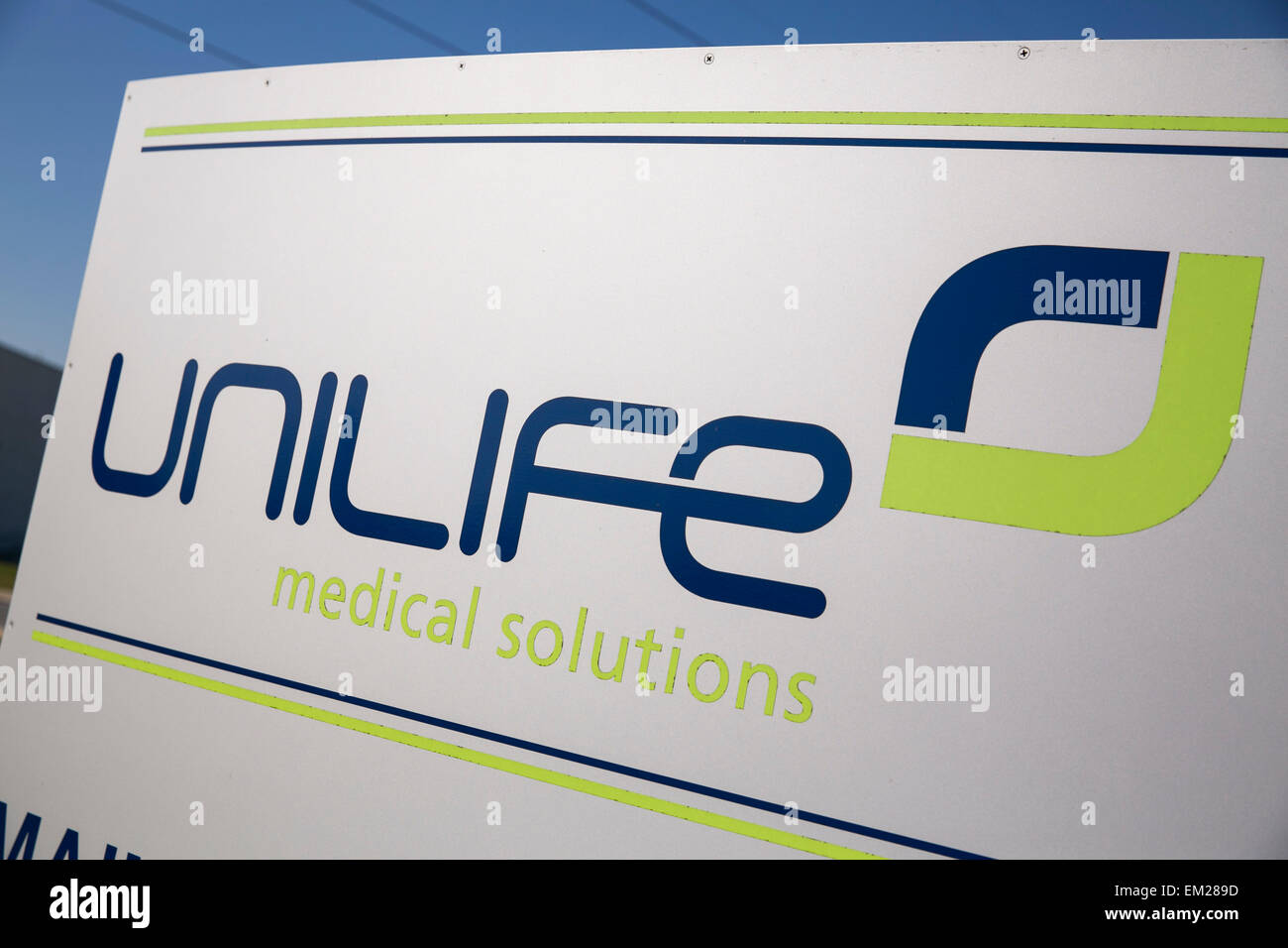 A logo sign outside the headquarters of the Unilife Corporation in York, Pennsylvania. Stock Photo