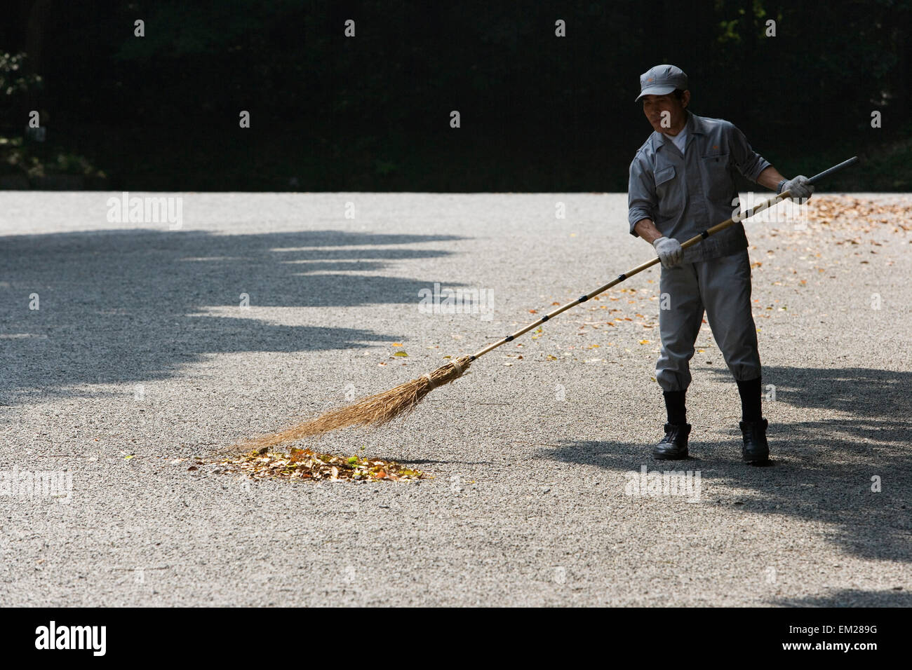 A man sweeping Stock Photo Alamy