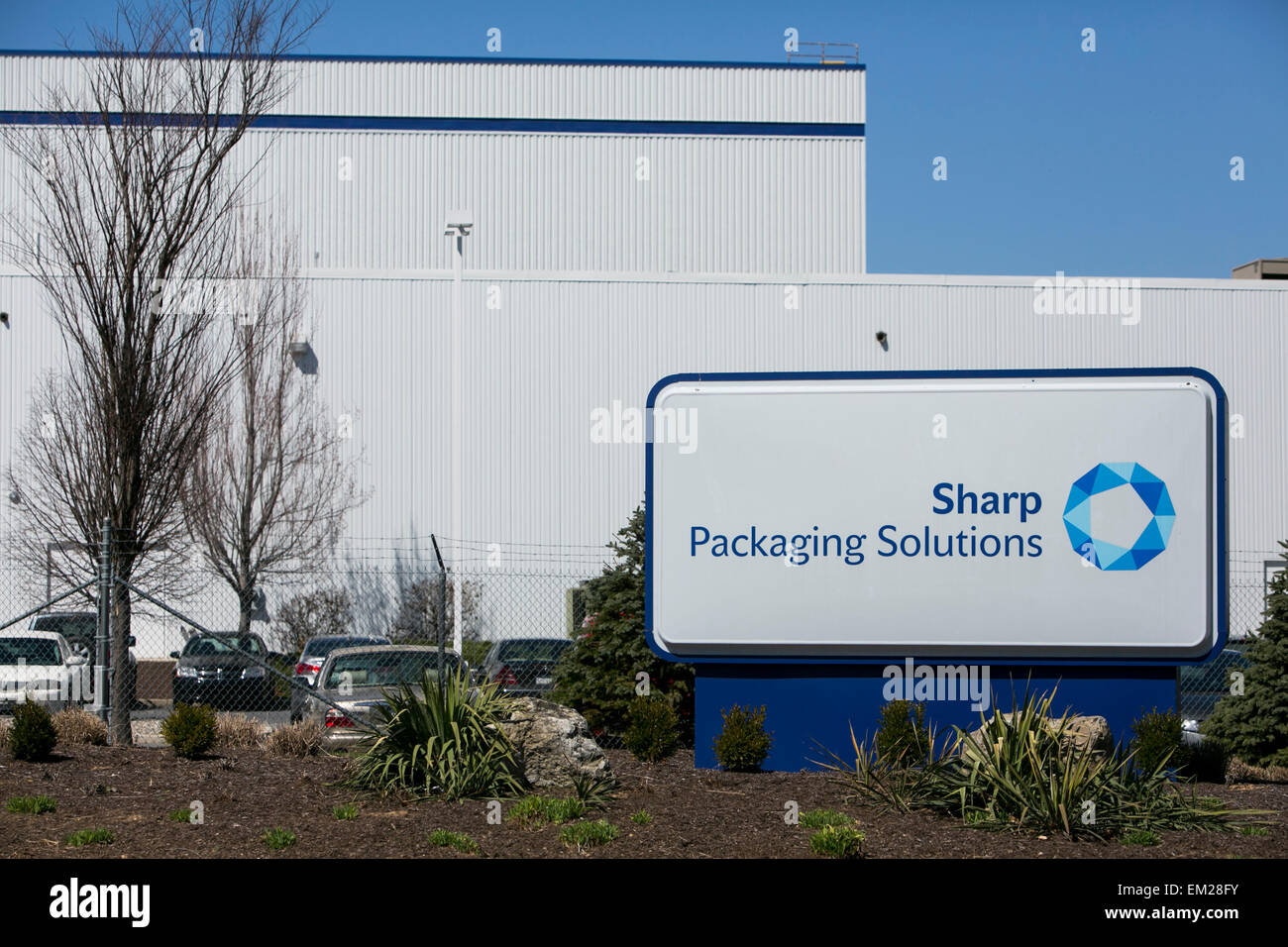 A logo sign outside of a facility operated by Sharp Packaging Solutions in Allentown, Pennsylvania. Stock Photo