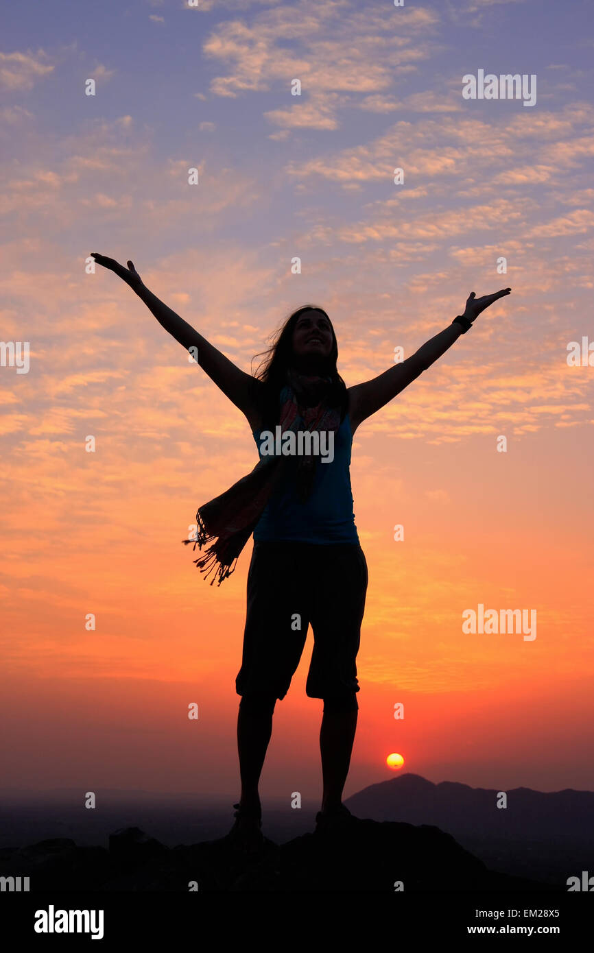Woman sunset sky arms hi-res stock photography and images - Alamy
