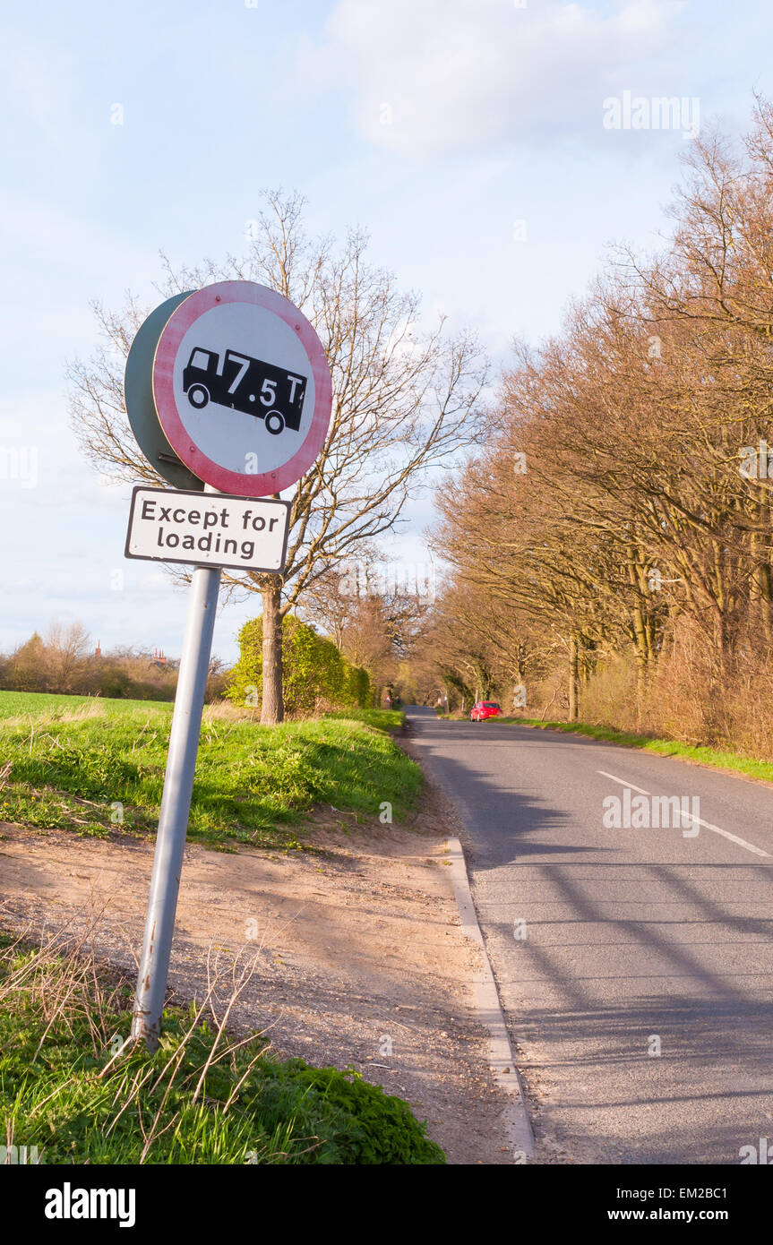 Rural view of a road sign No lorries over maximum gross weight shown (in tonnes) except for loading and unloading Stock Photo