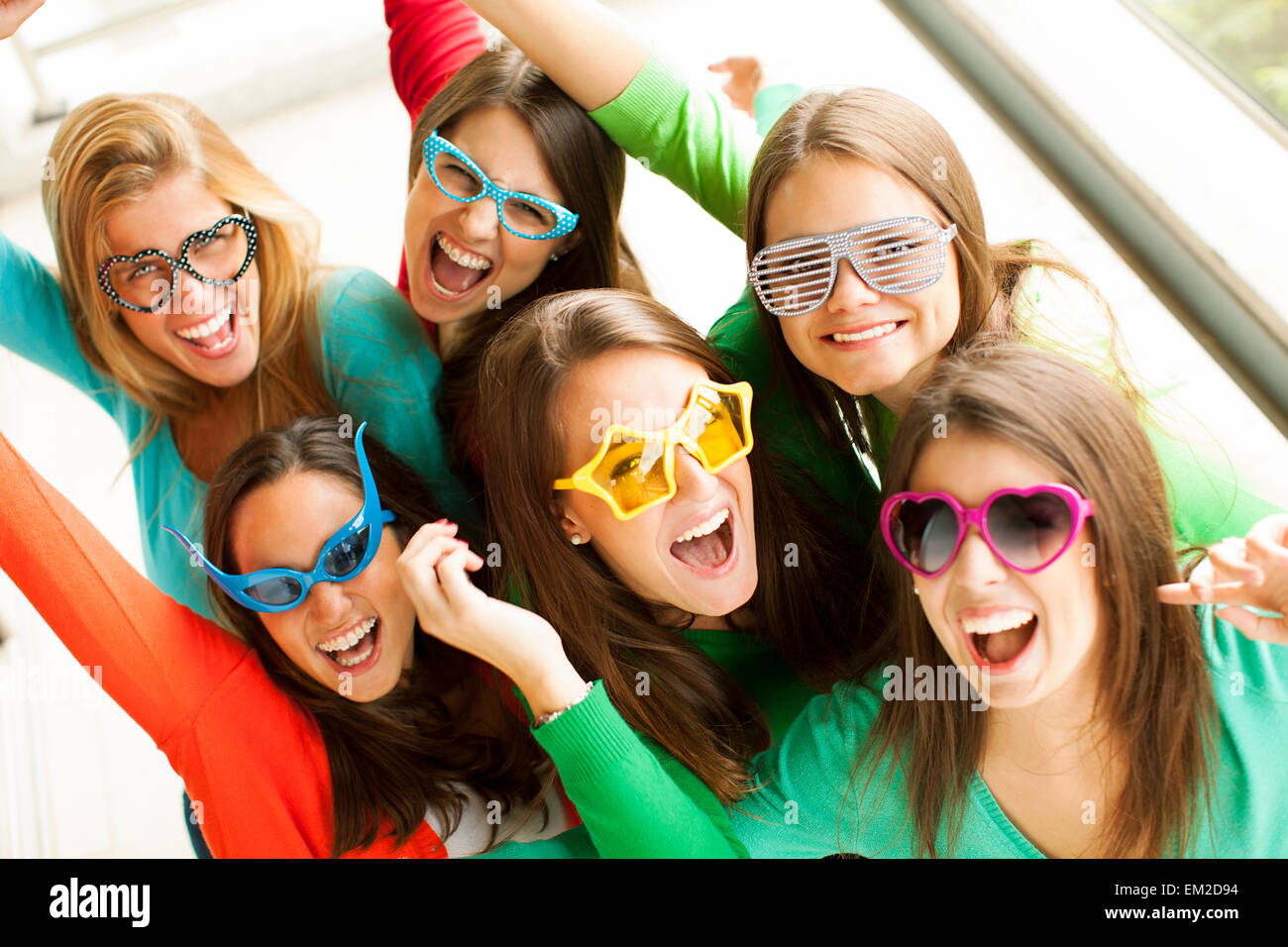 Smiling teenagers with funny glasses Stock Photo