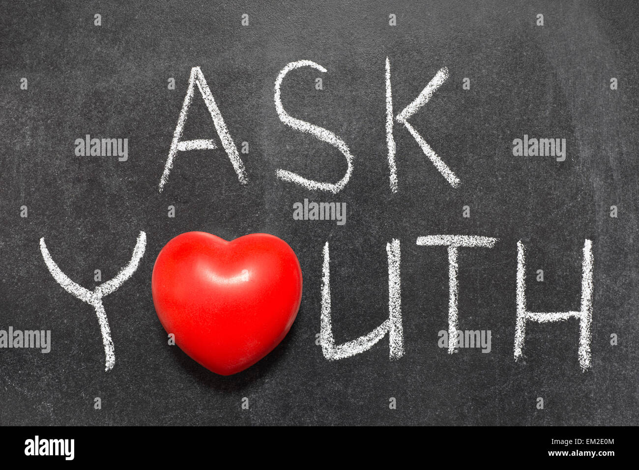 ask youth phrase handwritten on blackboard with heart symbol instead of O Stock Photo