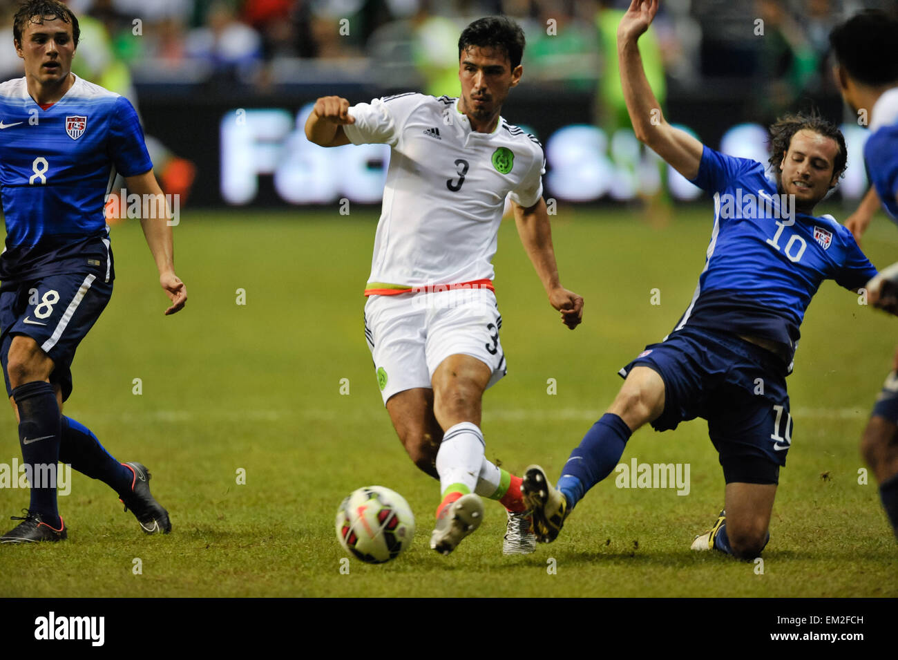 San Antonio, TX, USA. 15th Apr, 2015. Mexico's Oswaldo Alanis controls the ball in front of USA's Mix Diskerud during a friendly match Wednesday April 15, 2015 at the Alamodome in San Antonio, Texas. The US Men's National team defeated Mexico, 2-0. © Bahram Mark Sobhani/ZUMA Wire/Alamy Live News Stock Photo