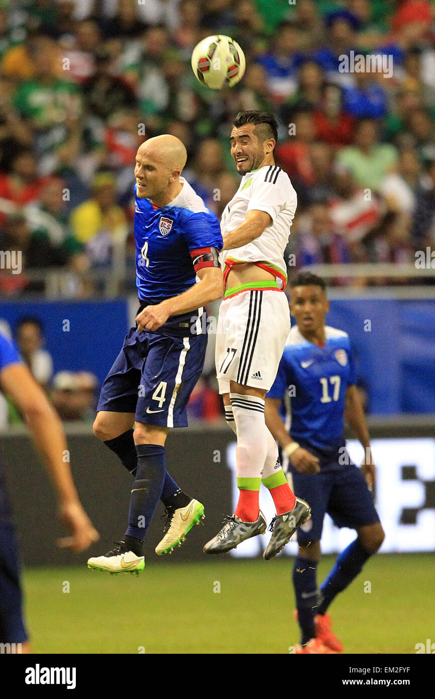 Texas, USA. 15th Apr, 2015. U.S. player Michael Bradley (L) vies for the ball with Mario Osuna (R) of Mexico during the friendly international match held at the Alamodome Stadium in San Antonio, Texas, United States of America, April 15, 2015. © Omar Vega/NOTIMEX/Xinhua/Alamy Live News Stock Photo