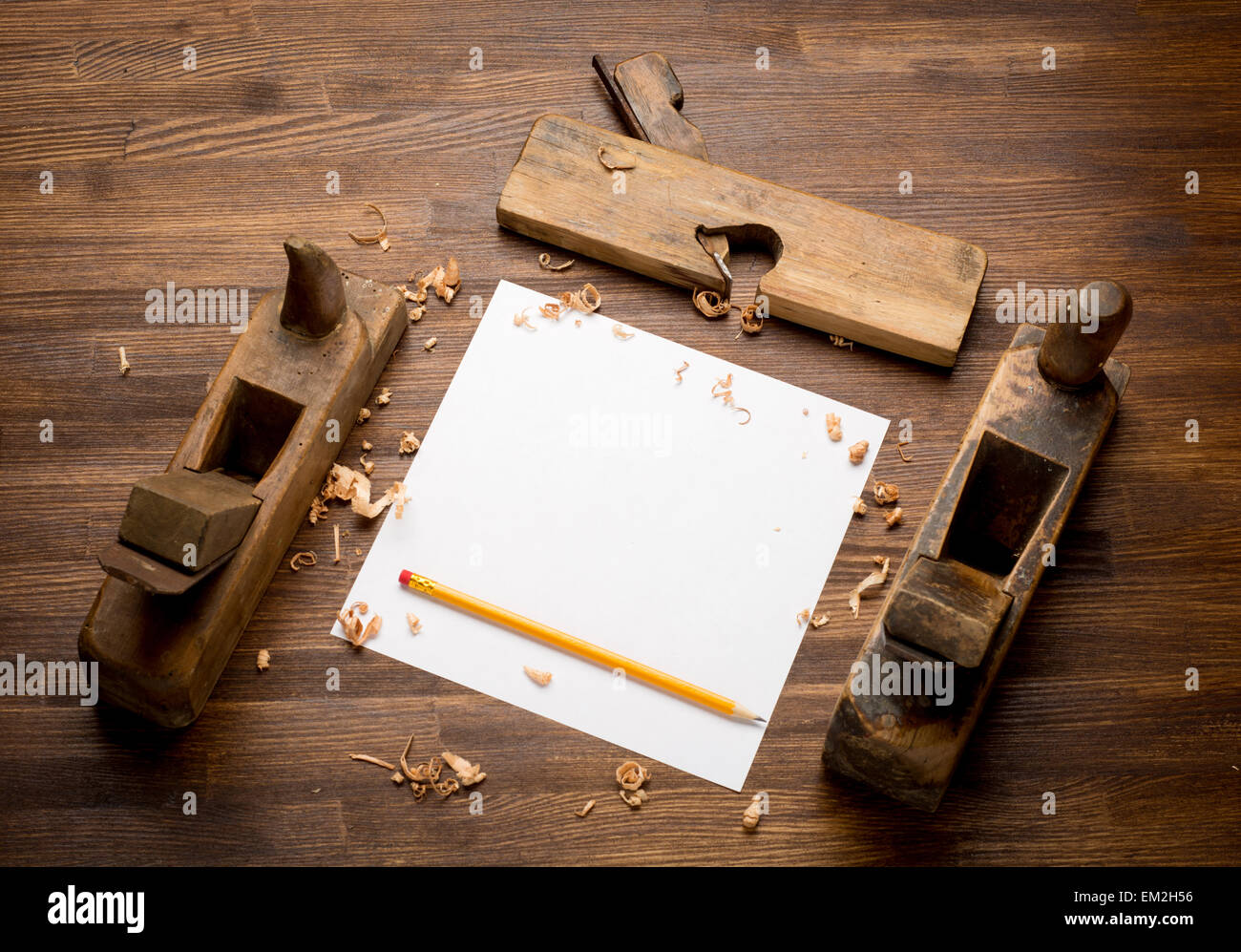 Old wooden jointers on the wood table with grunge texture Stock Photo