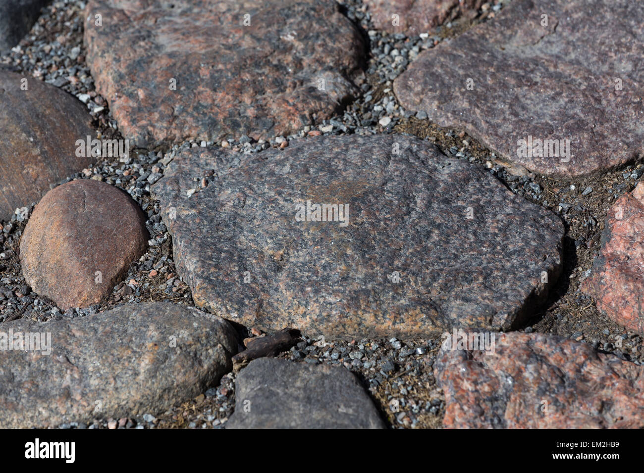 Granite old stone road texture as a background Stock Photo - Alamy