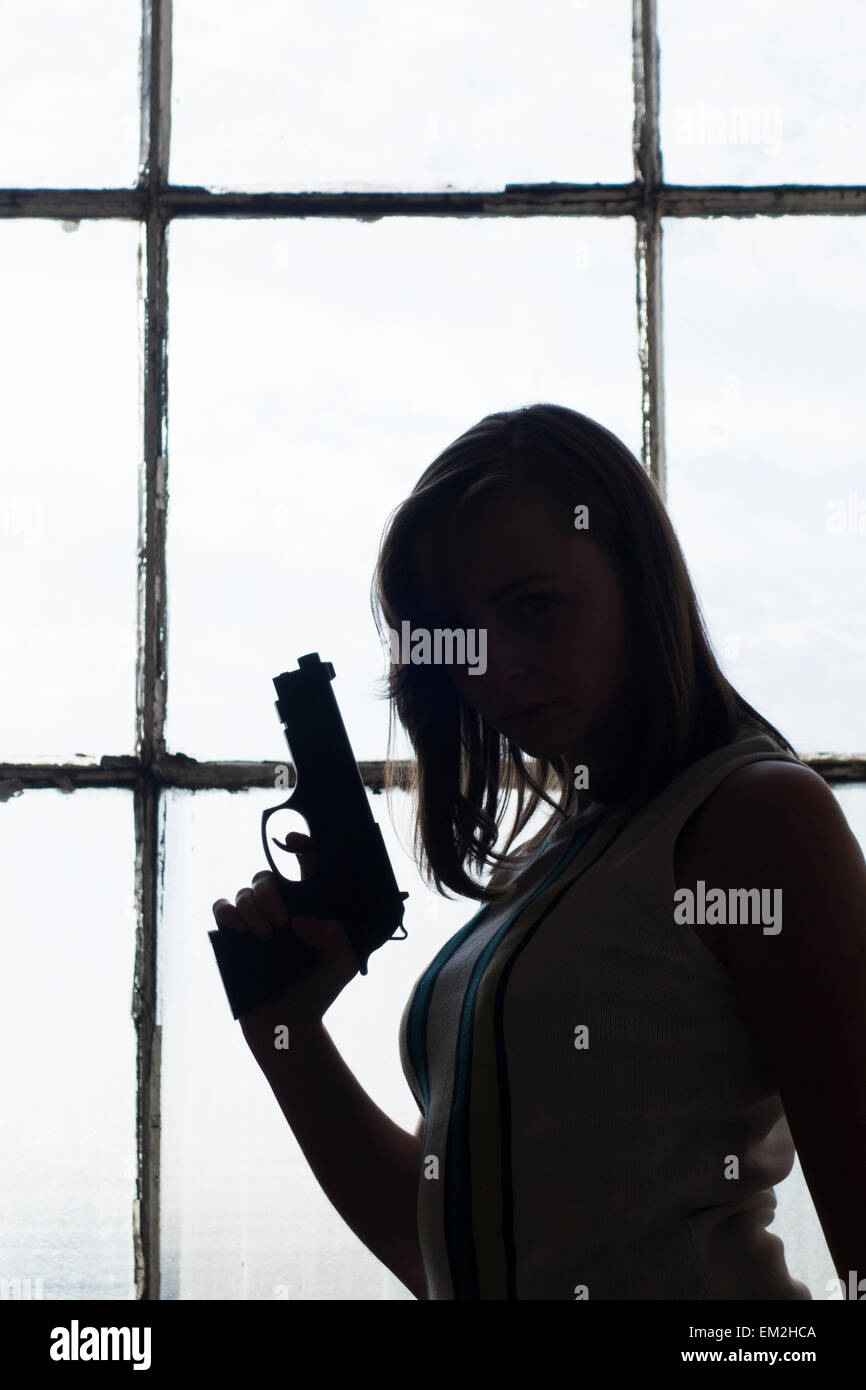 Woman with a gun Stock Photo