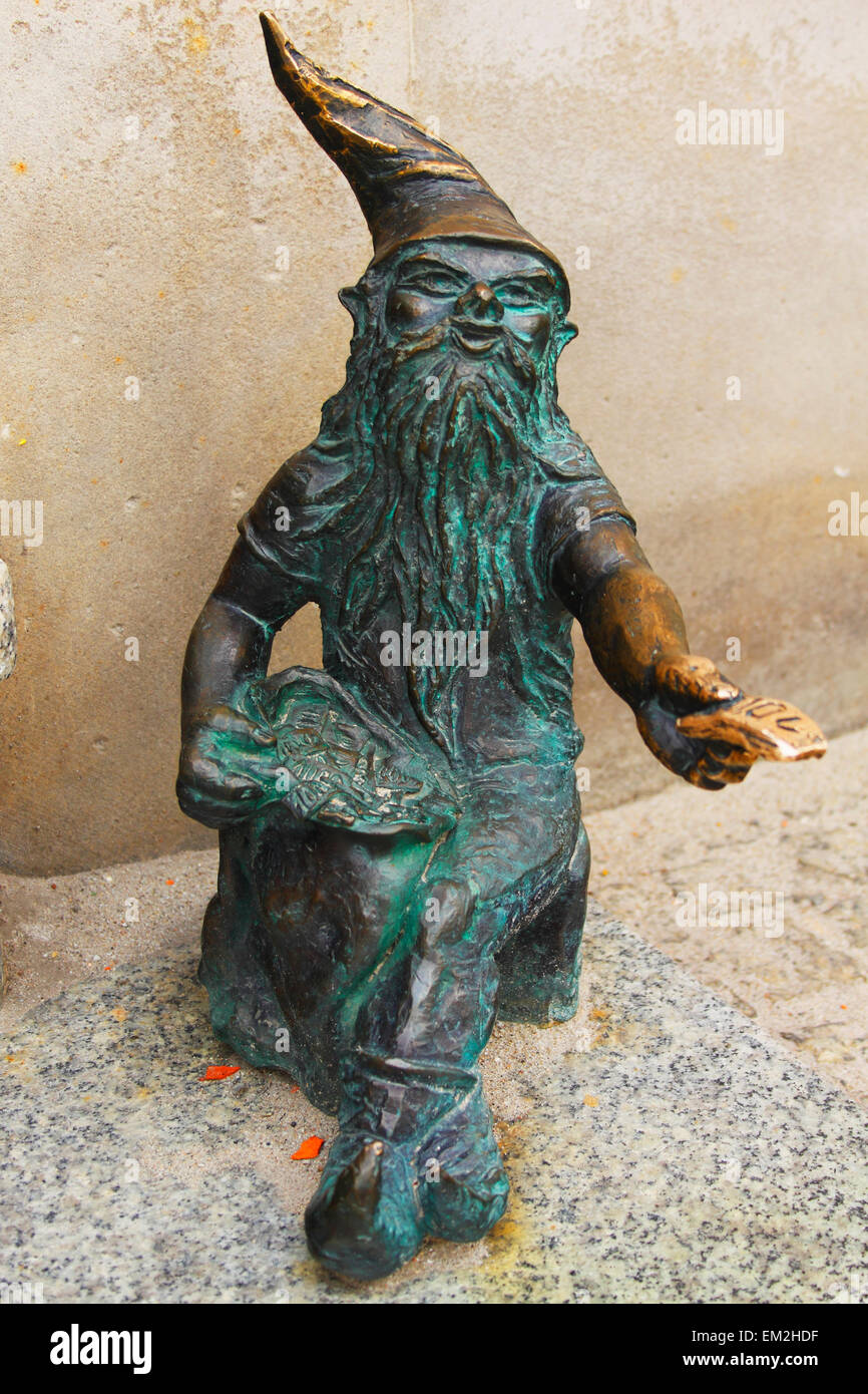 Bronze Sculpture Of A Gnome Beside A Cash Point; Wroclaw Poland Stock Photo