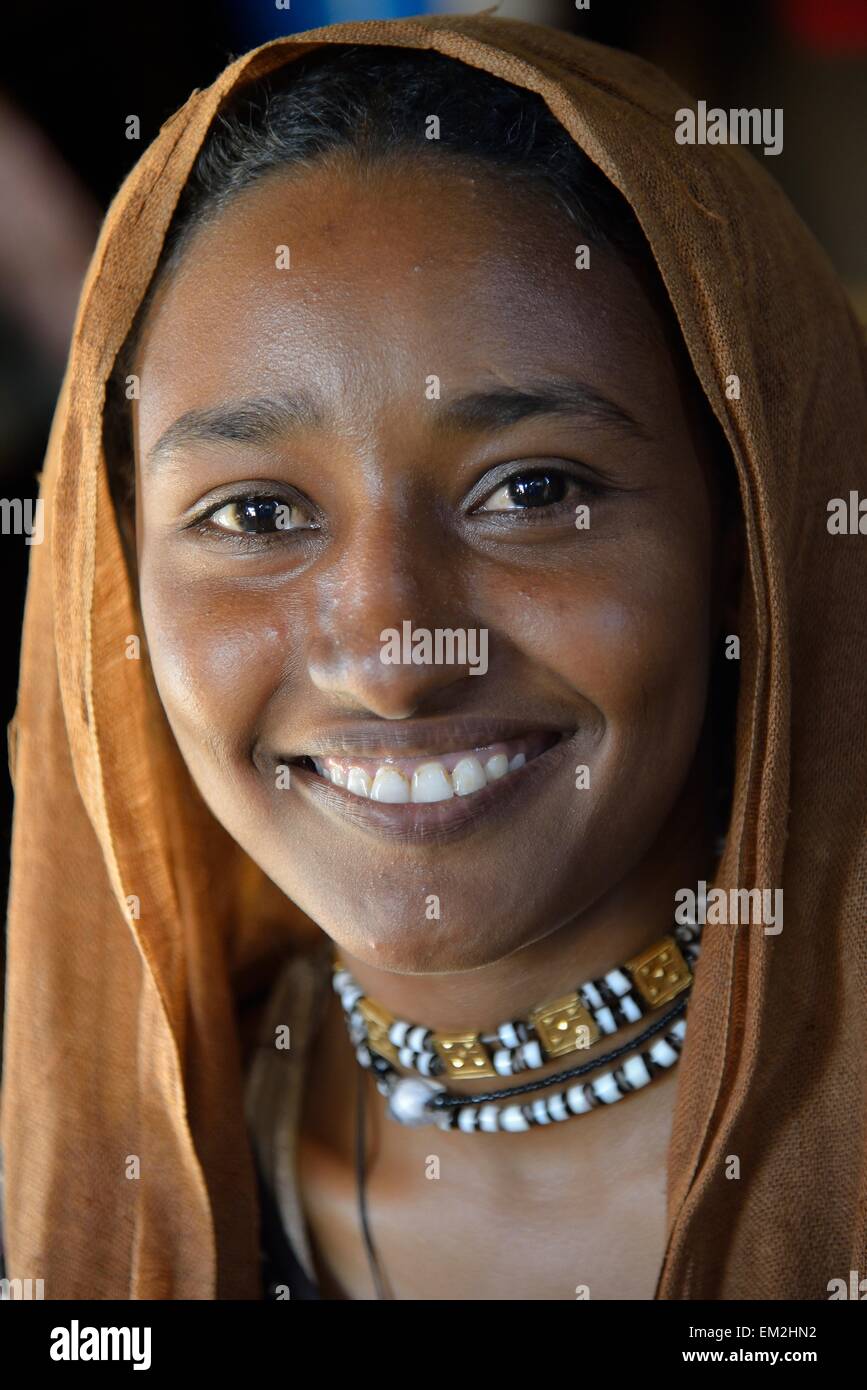 Young girl from a nomadic tribe, wearing headgear, portrait, Bayuda Desert, in Karima, Nubia, Northern Sudan, Sudan Stock Photo