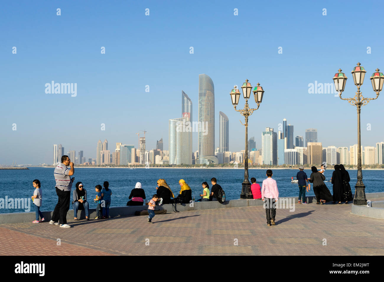 Daytime skyline view and local people in Abu Dhabi in United Arab Emirates Stock Photo