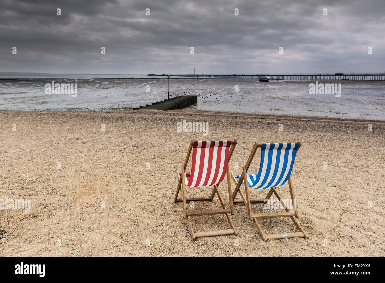 Empty deckchairs on Jubilee beach at Southend on a cloudy day inn Essex. Stock Photo