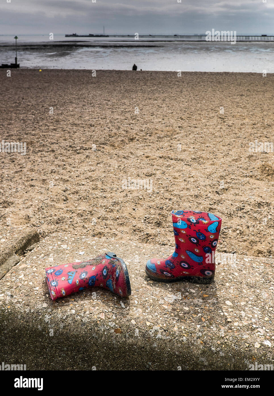 Childrens wellington boots left on Southend seafront in Essex. Stock Photo