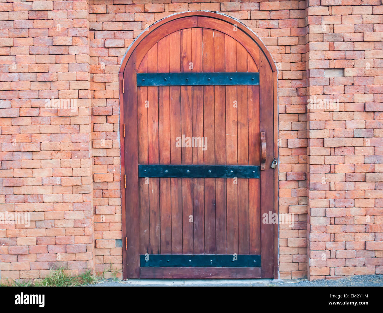 grunge wooden gate in brick wall background Stock Photo Alamy