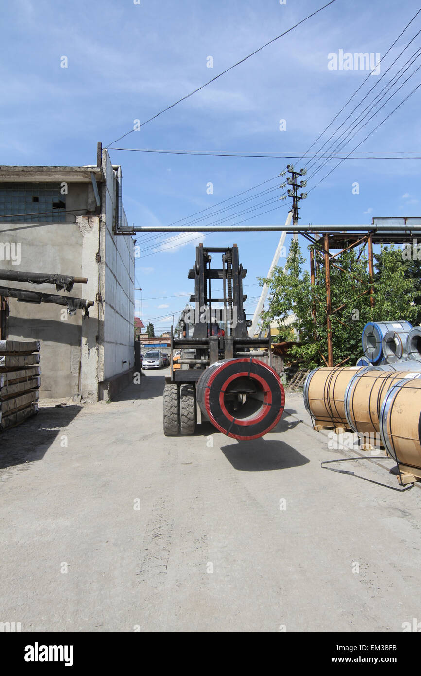 view of the storage of steel coils with a loader for loading and ...