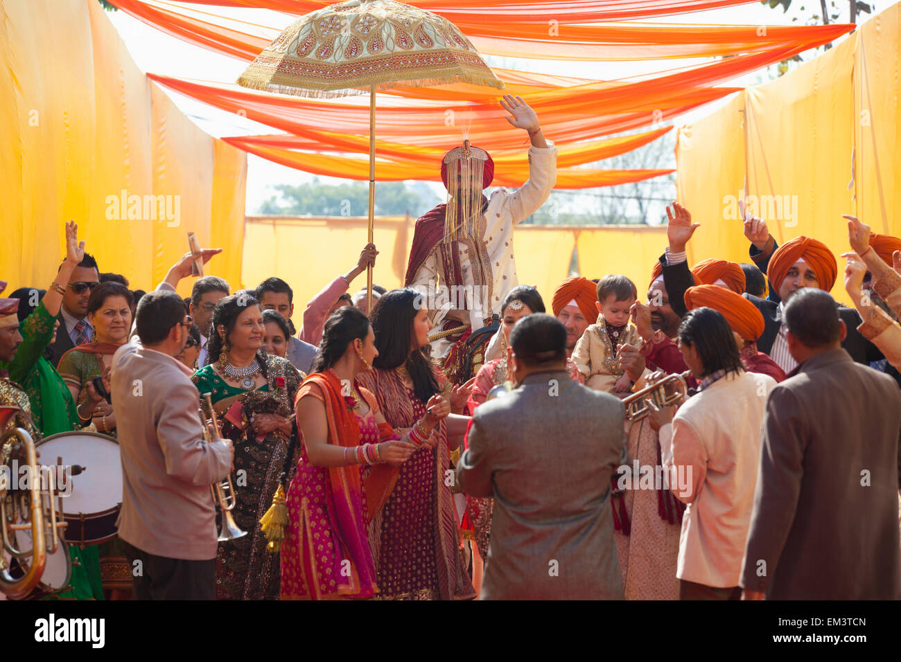 Family And Friends Greet The Groom At An Indian Wedding; Ludhiana, Punjab, India Stock Photo