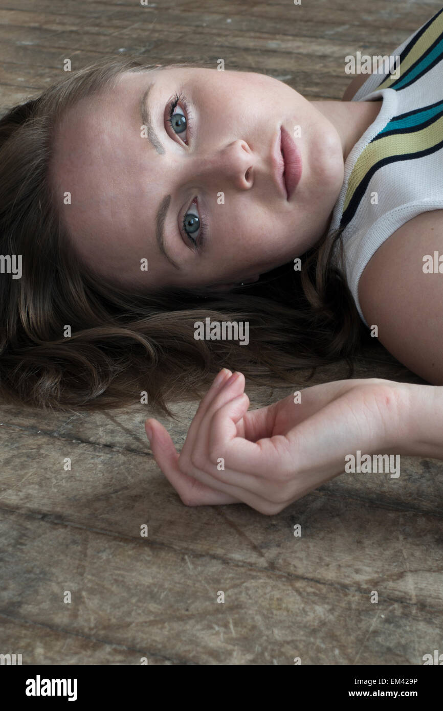 Beautiful girl lying on floor hi-res stock photography and images - Alamy