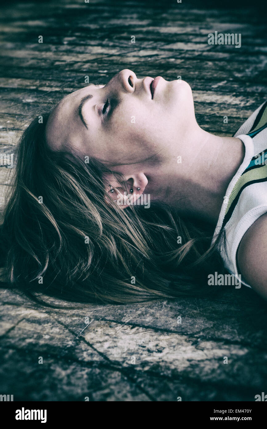 Dead woman lying on floor hires stock photography and images Alamy