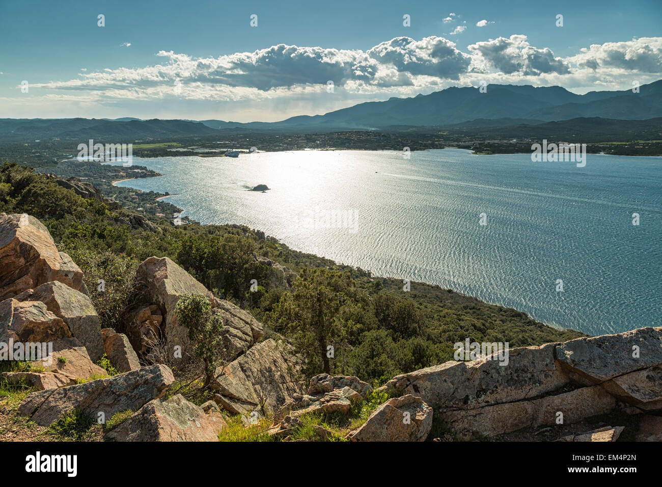 The gulf of Porto-Vecchio in the south of the island of Corsica with the town and hills in the background Stock Photo