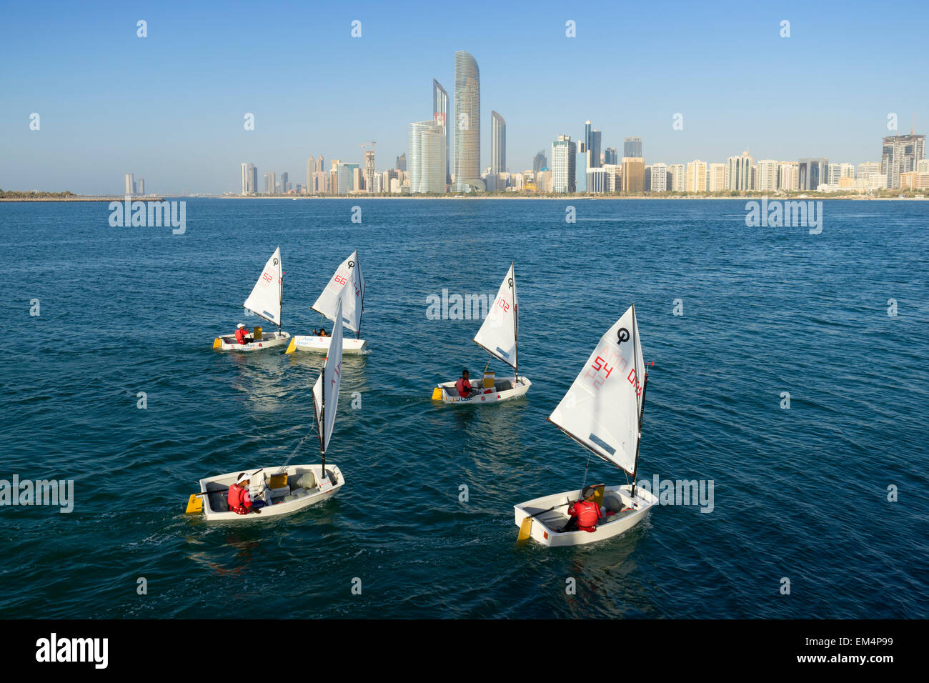 Daytime skyline view and sailing boats in Abu Dhabi in United Arab Emirates Stock Photo
