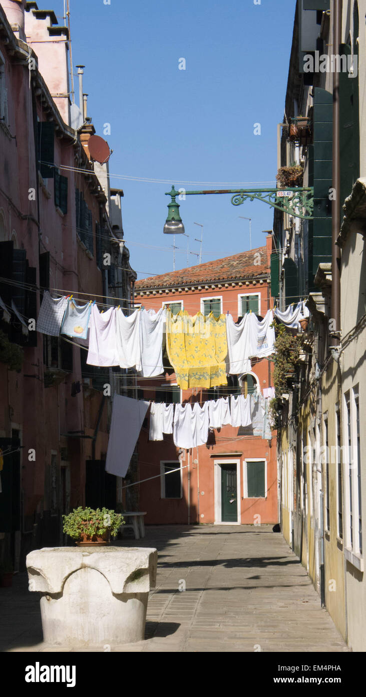A side street in Venice with clothes line hanging across the street Stock Photo