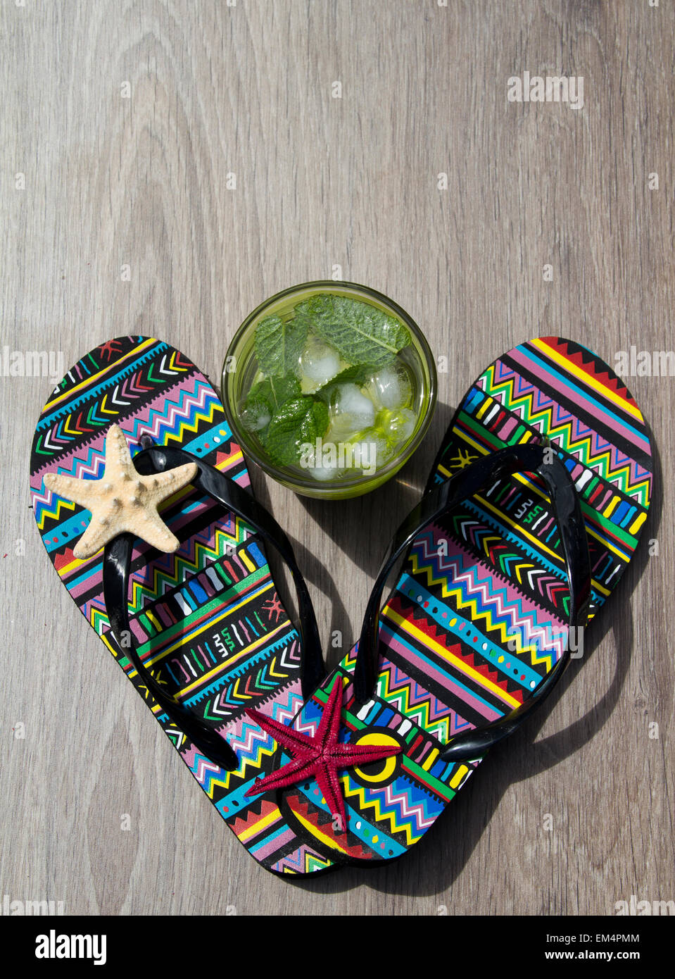 summer background with mojito, flip flops and starfish Stock Photo