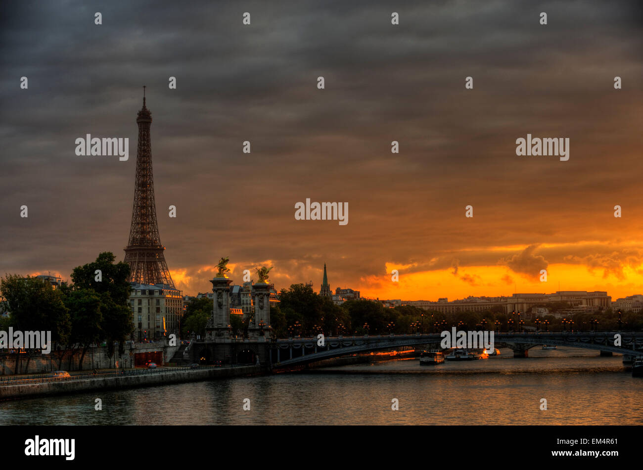 Sundown at Eiffel Tower, Seine Bridge Pont Alexandre III in  Paris, Ile de France, France, Europe Stock Photo
