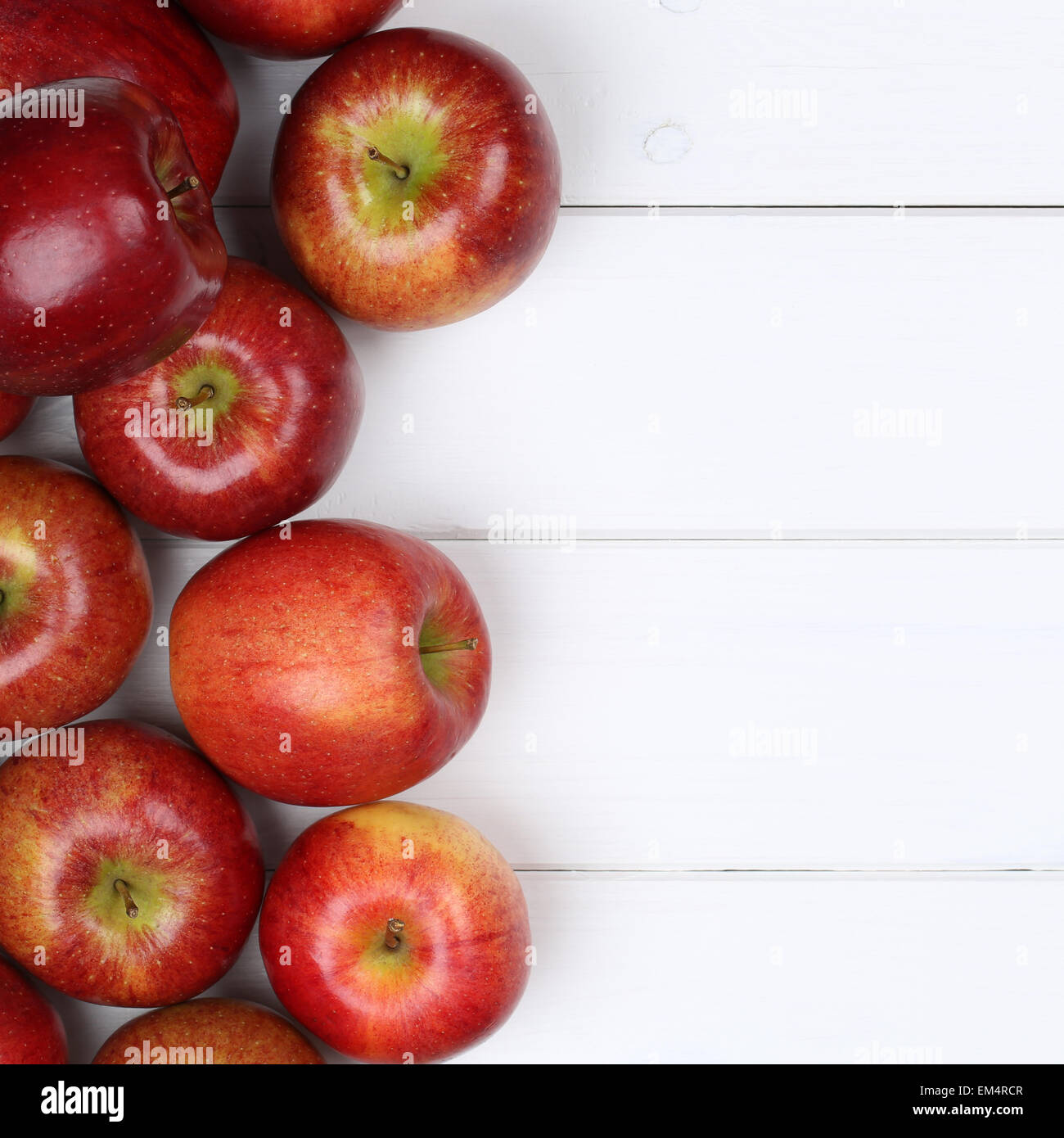 Red apple apples fruits on a wooden board with copyspace Stock Photo