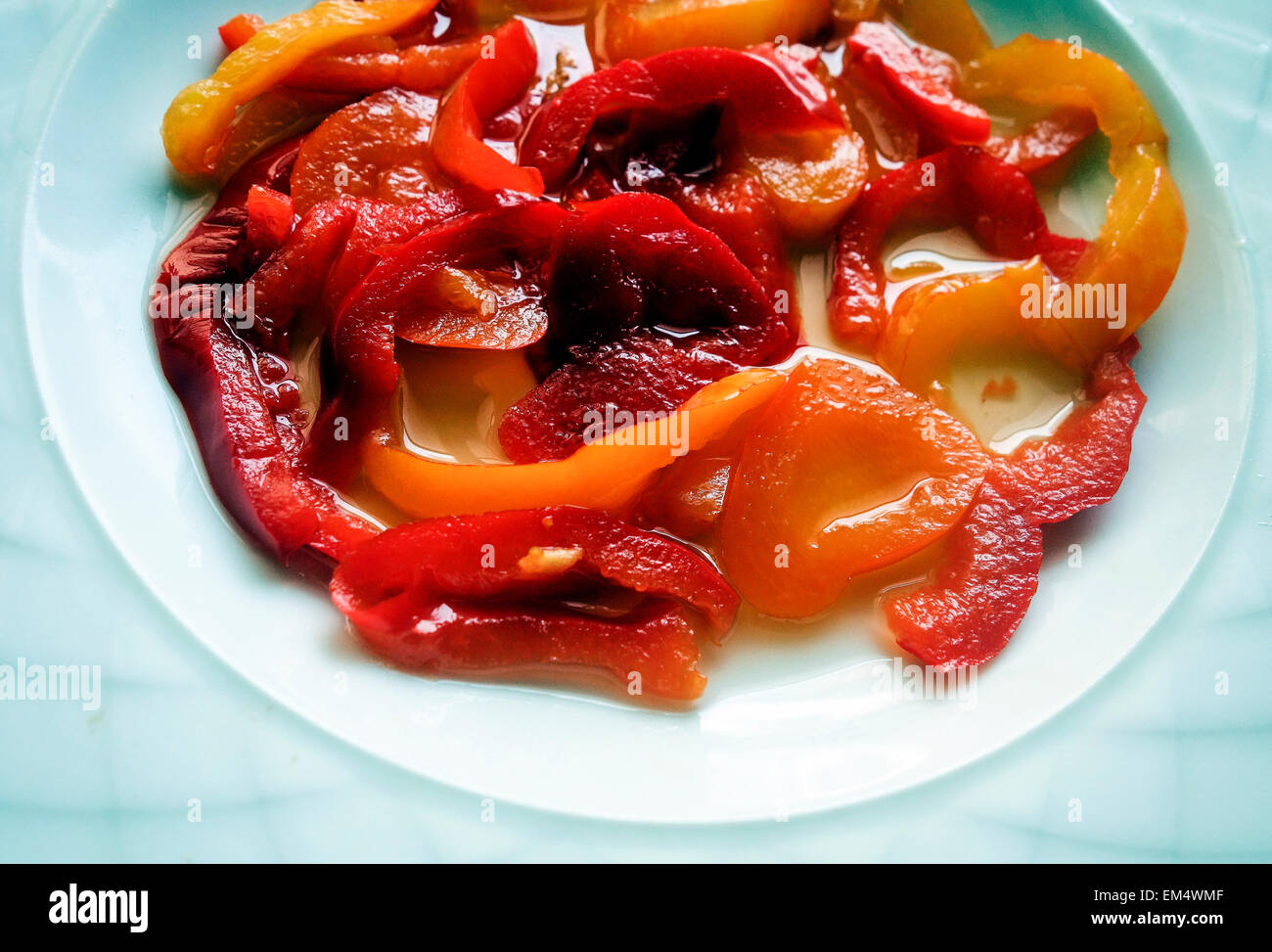 Greek Cuisine. Red and Yellow Pepper Strips in Brine. Side Salad Stock Photo