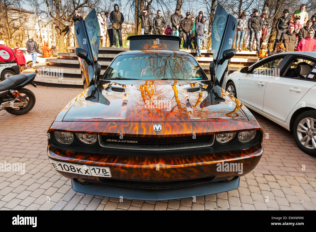 Saint-Petersburg, Russia - April 11, 2015: Dodge challenger with aggressive street race design stands with open doors, front vie Stock Photo