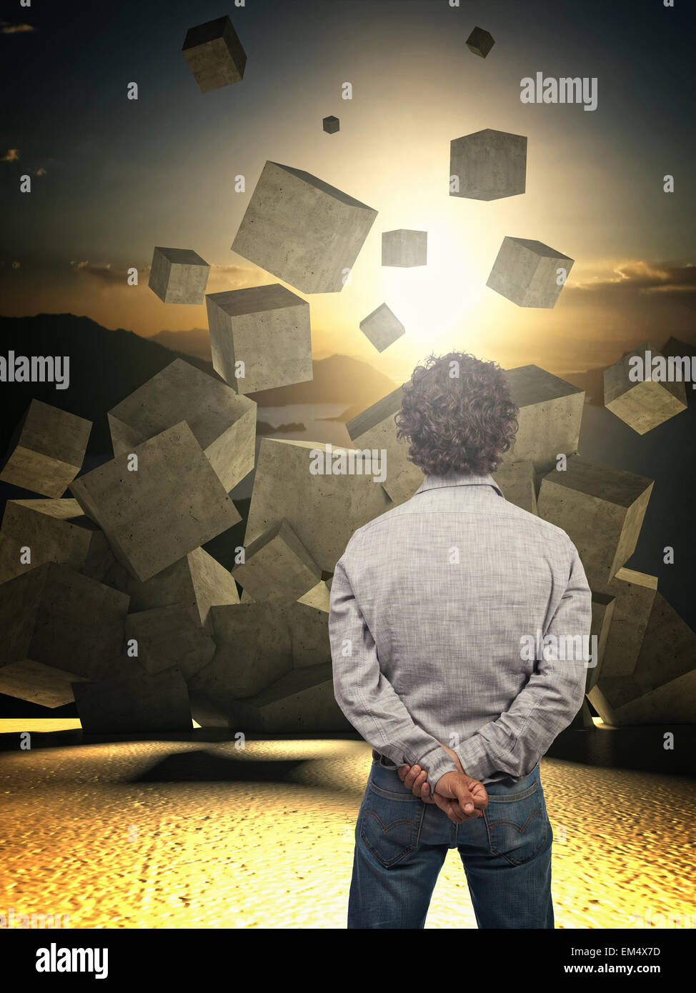man look croncrete abstract cubes falling from the sky Stock Photo