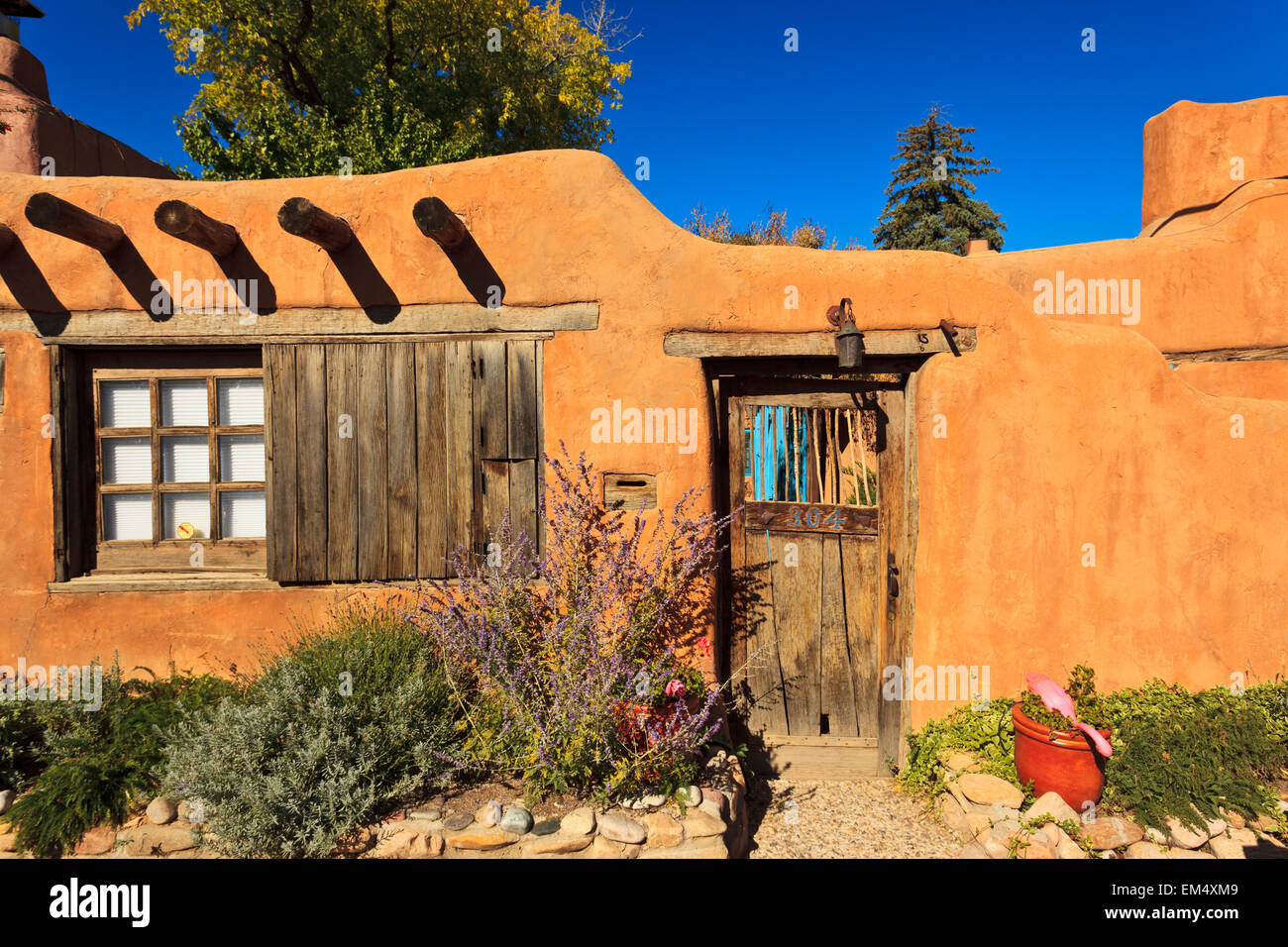 View of old wooden door in wall off Canyon Road; Santa Fe, New Mexico