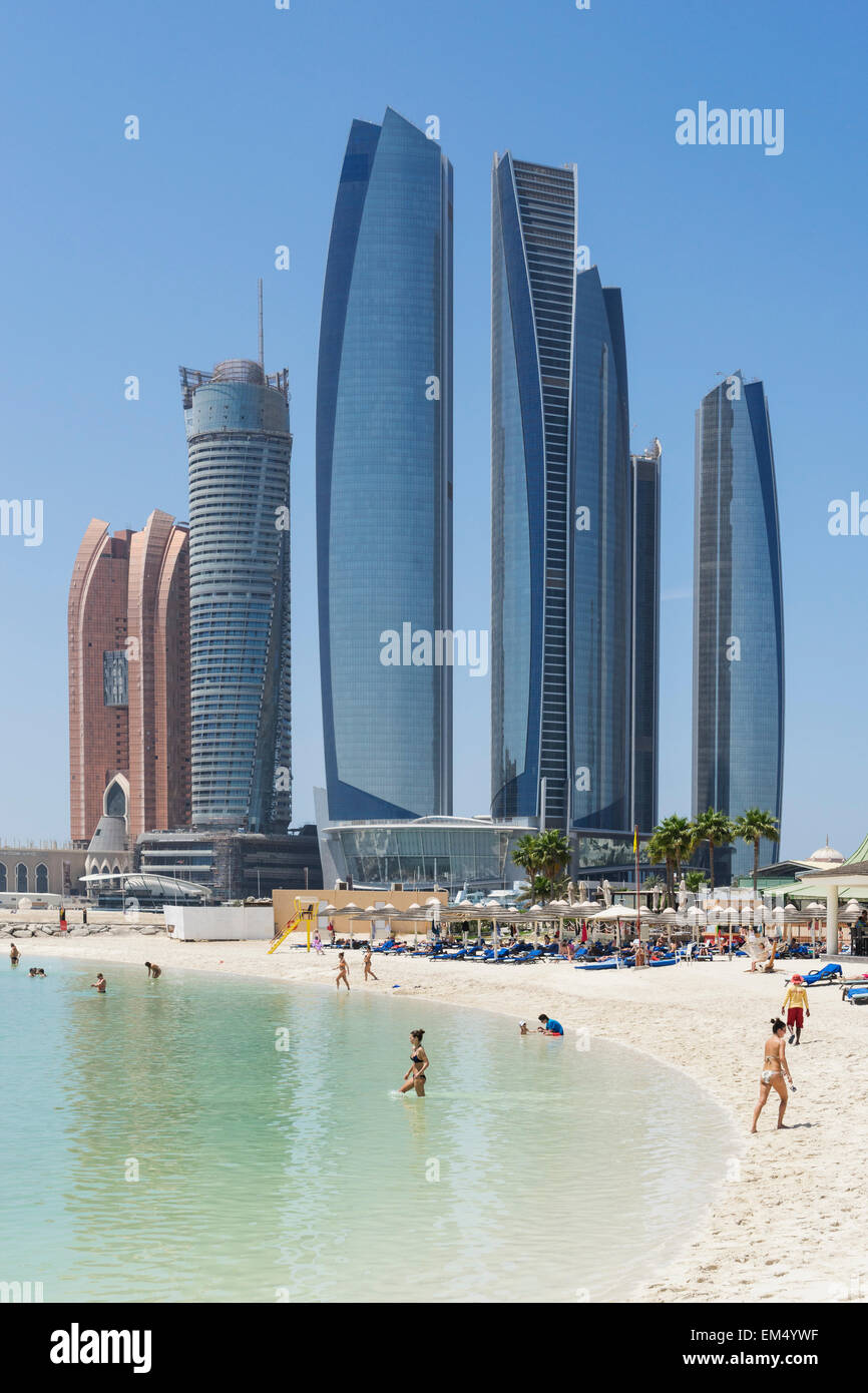 Skyline view of Etihad Towers from luxury hotel beach in Abu Dhabi in United Arab Emirates Stock Photo