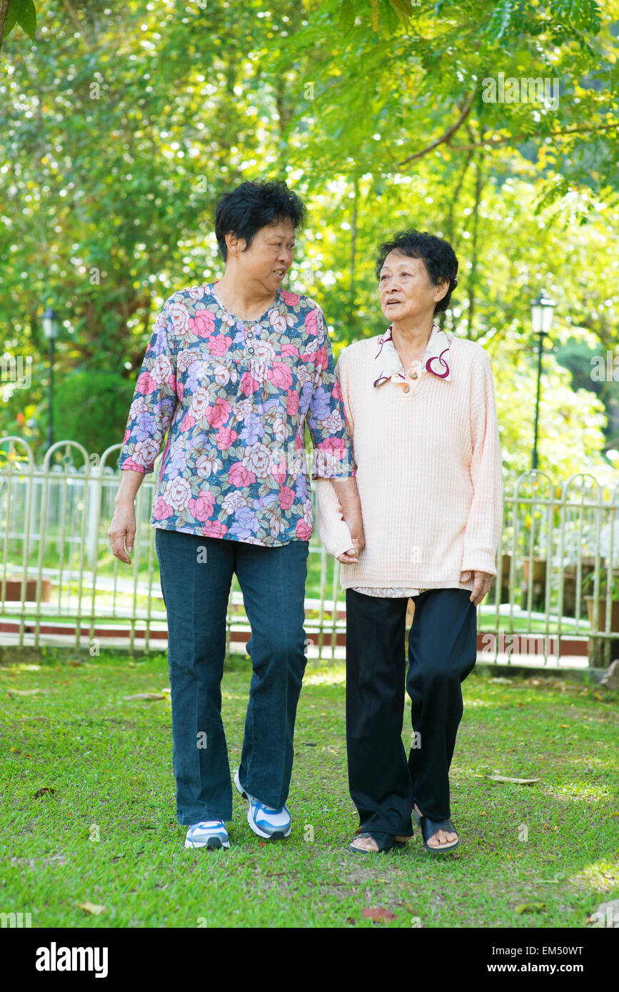 Asian senior women walking at outdoor park Stock Photo - Alamy