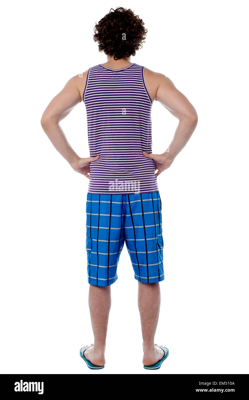 Rear view of a man in beach wear Stock Photo