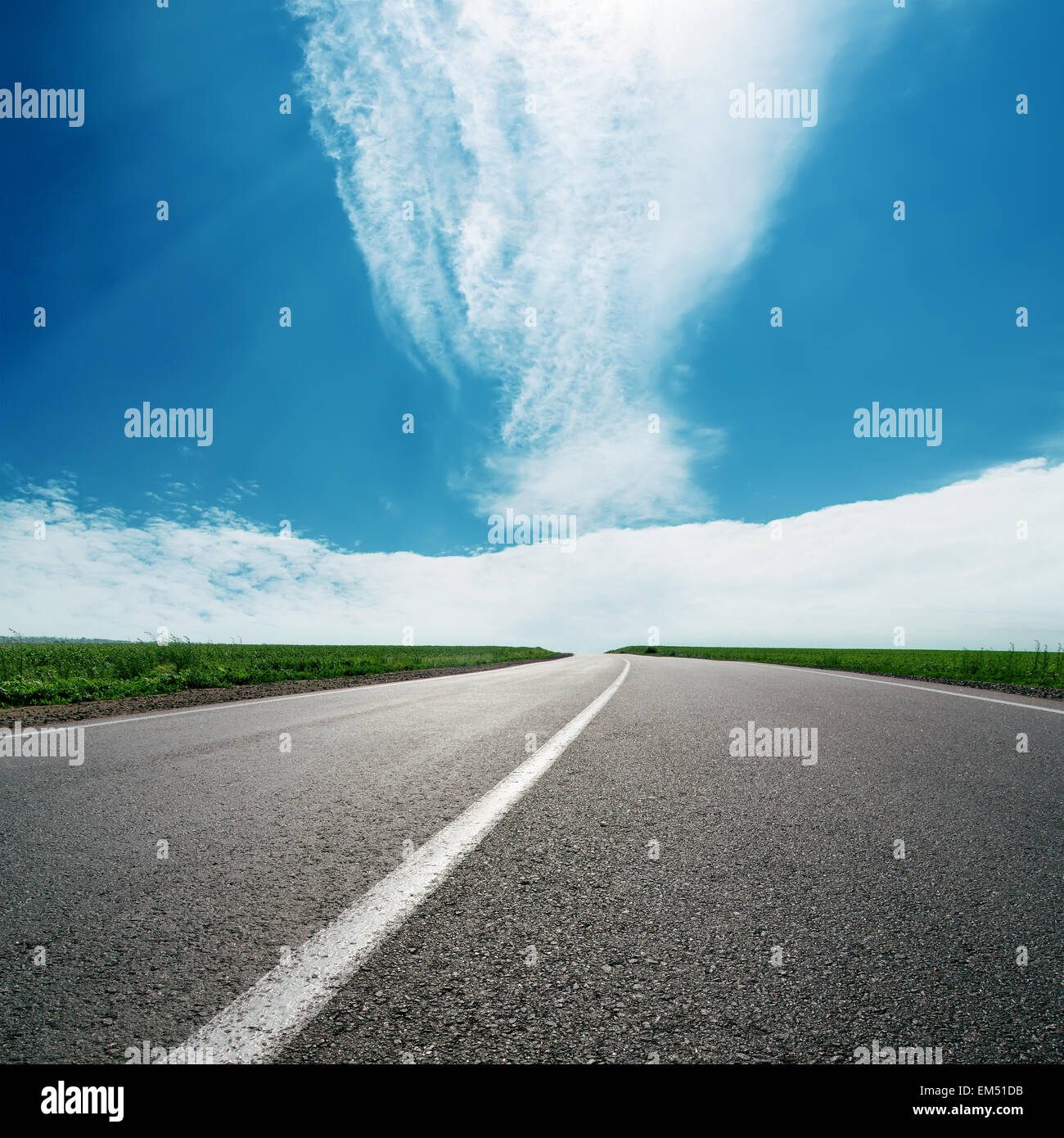 asphalt road to cloudy horizon in blue sky Stock Photo - Alamy