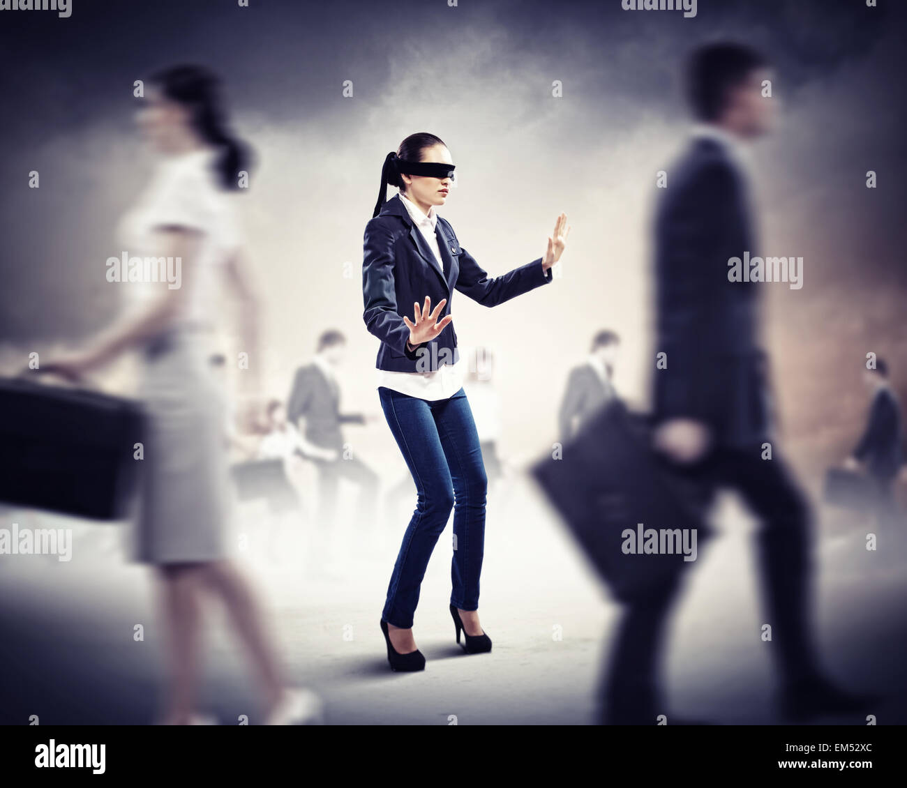 Businesswoman in blindfold among group of people Stock Photo - Alamy