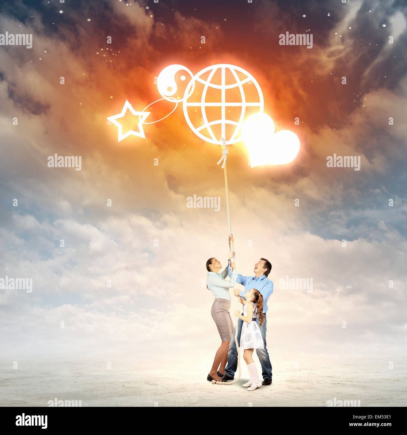 Family pulling rope Stock Photo - Alamy