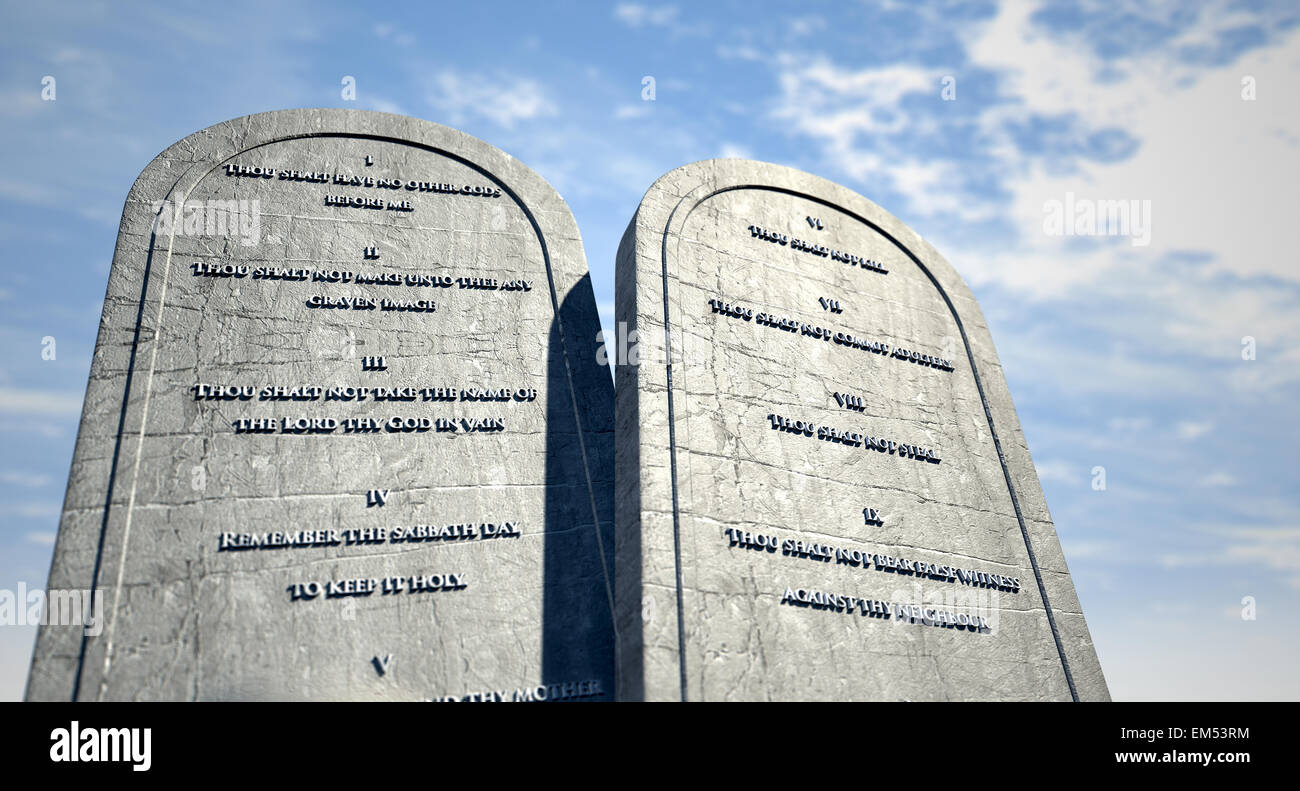 Two stone tablets with the ten commandments inscribed on them standing