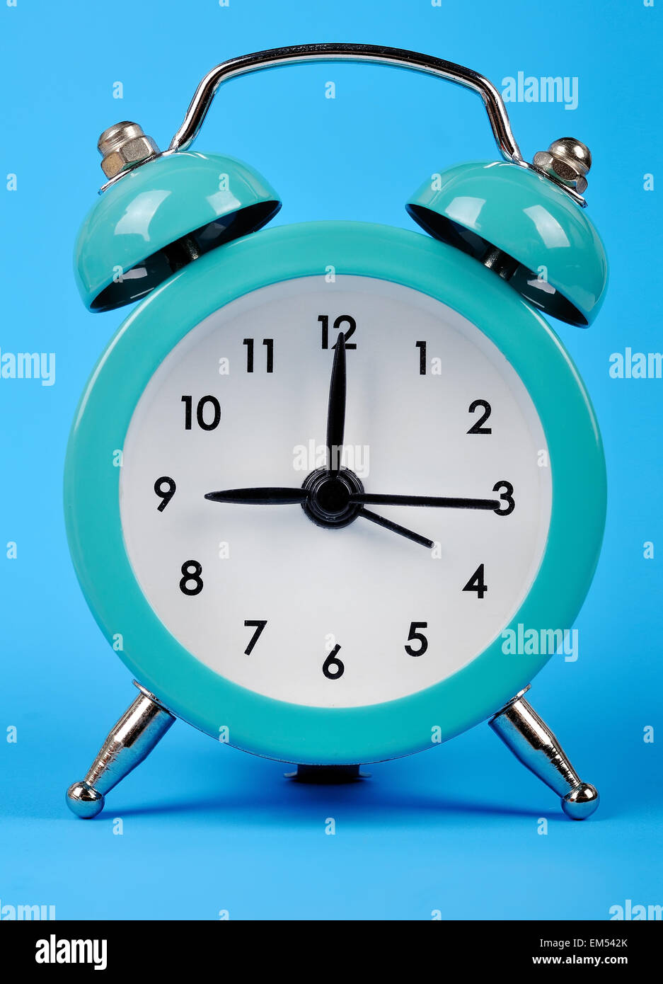 old style alarm clock isolated on blue Stock Photo Alamy