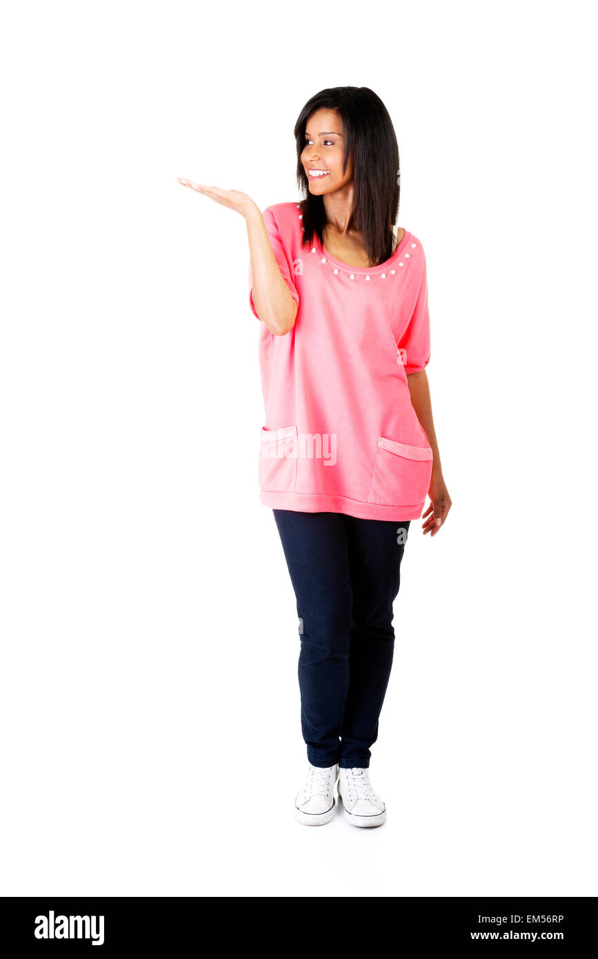 Happy , excited young woman presenting copy space on her palm Stock ...