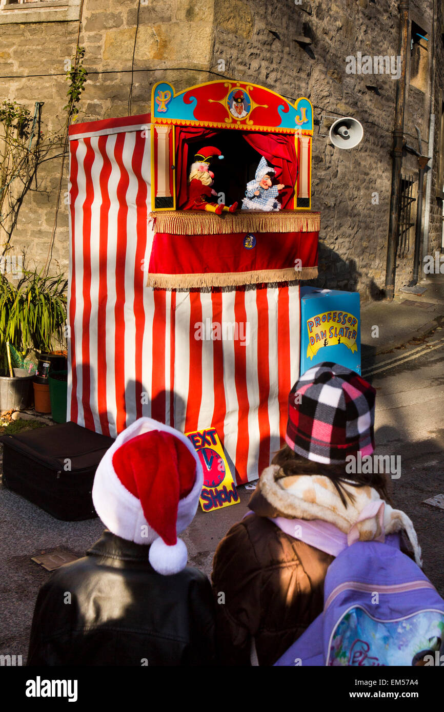 UK, England, Yorkshire, Grassington, Dickensian Festival, Children watching Punch and Judy show Stock Photo