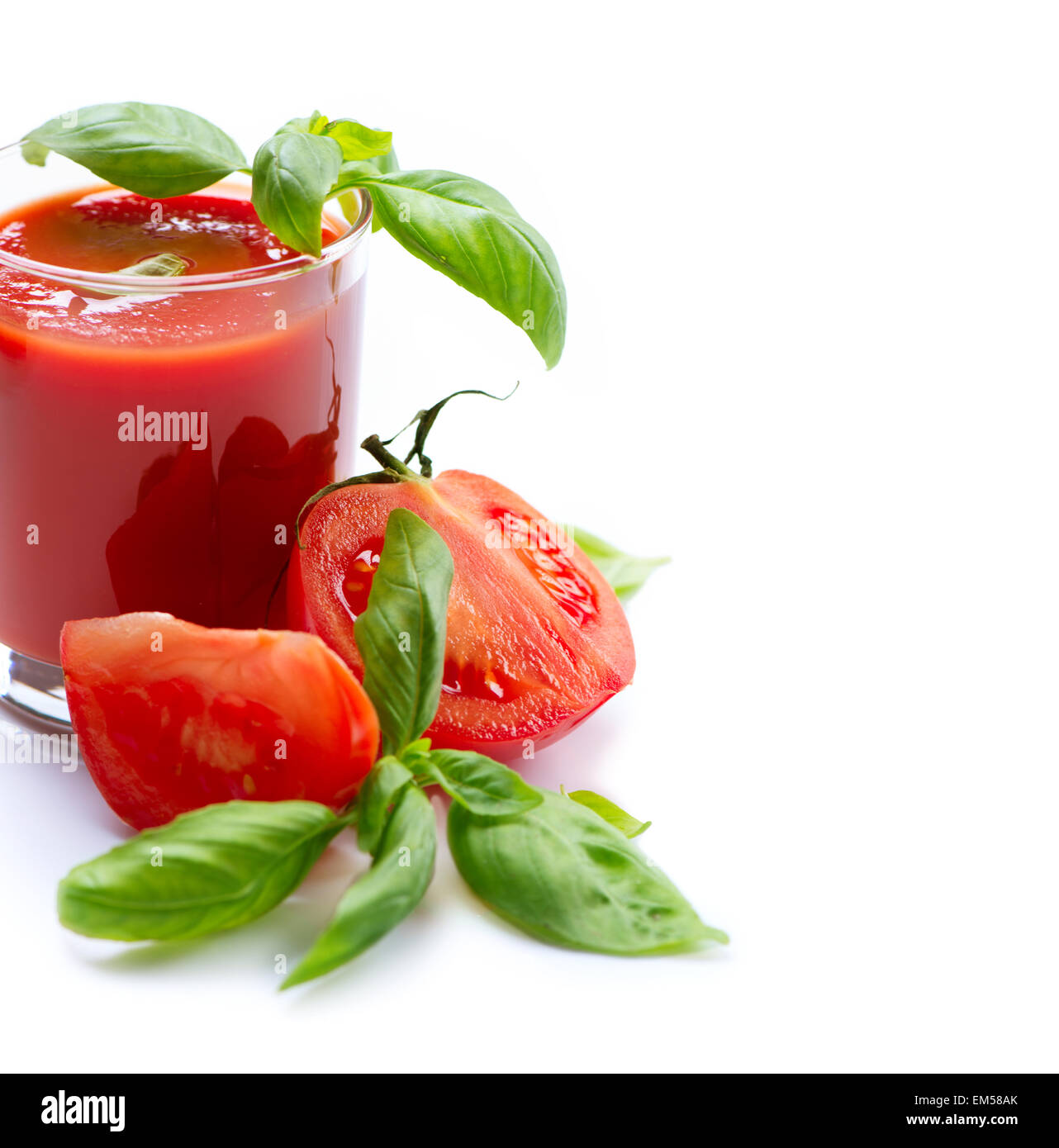 Tomato Juice and Fresh Tomatoes isolated on a White Background Stock Photo