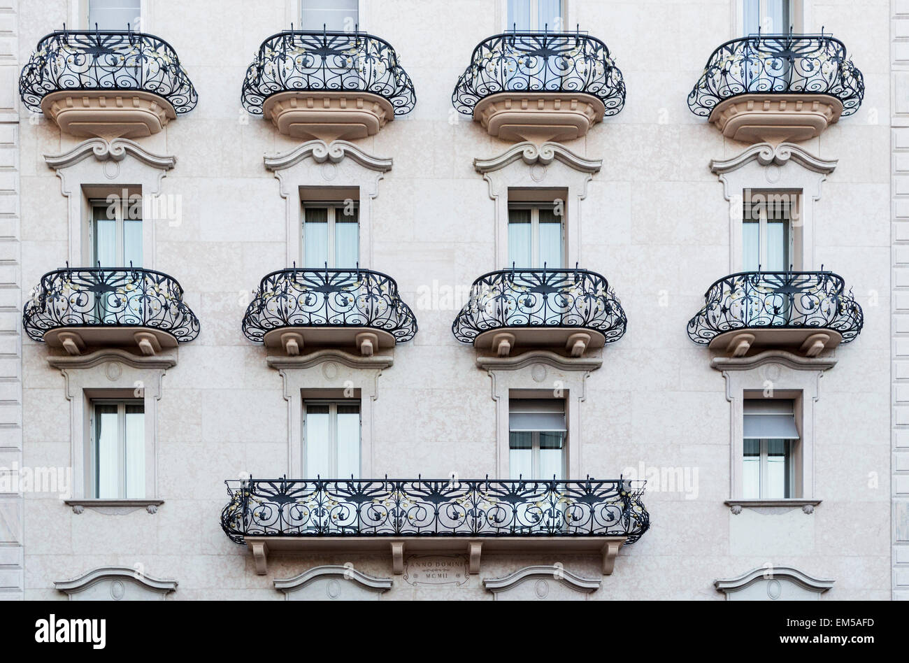 balconies and windows on the facade of a building Stock Photo