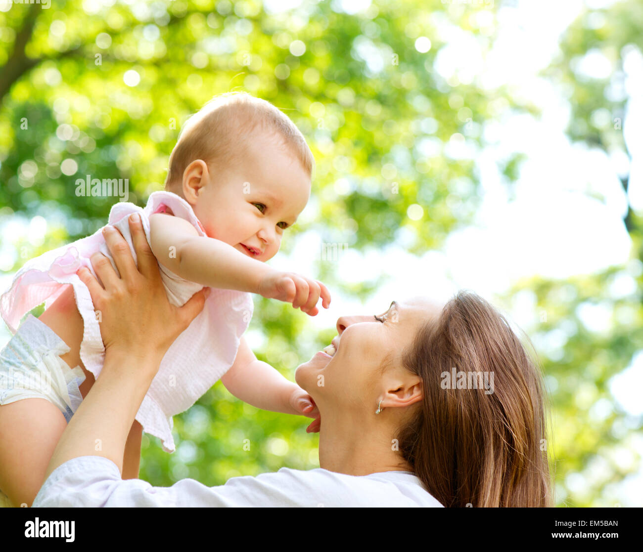 Beautiful Mother And Baby outdoors. Nature Stock Photo - Alamy