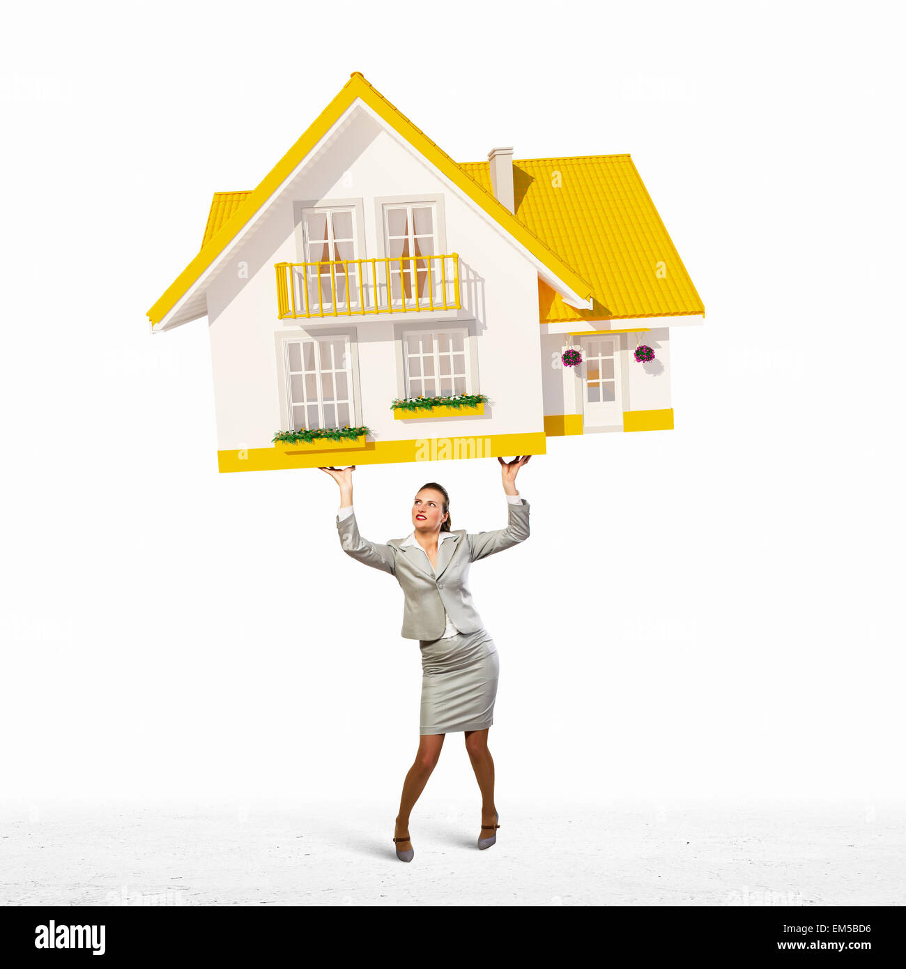 Businesswoman holding model of house Stock Photo - Alamy