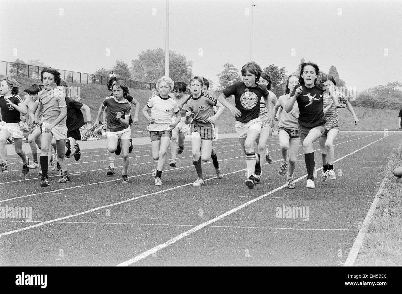 Boys and girls take part in a race at their school sports day. 20th June 1979. Stock Photo