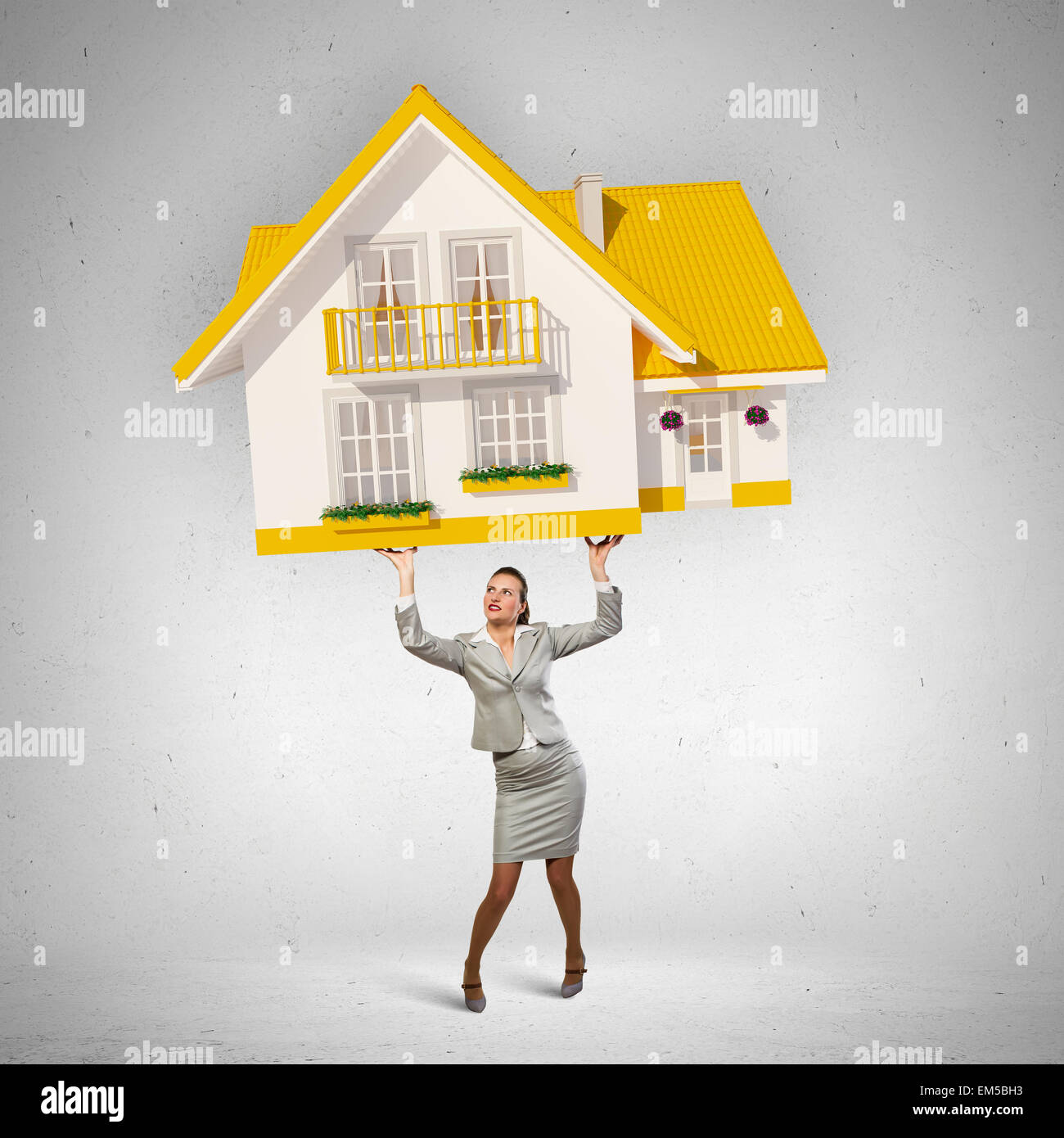 Businesswoman holding model of house Stock Photo - Alamy